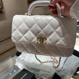 Absolutely stunning rare brand New Coco Chanel travel purse with handle .A must!